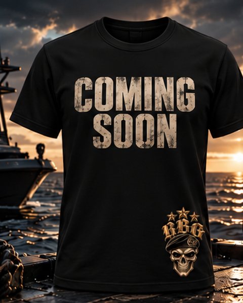 Black tee with Coming Soon across the chest and the RBG skull-in-beret on the hem, on a boat deck at dusk