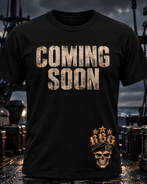 Black tee with Coming Soon across the chest and the RBG skull-in-beret on the hem, on a boat deck at dusk